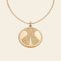 Collier médaille gravé d'une empreinte de truffe – Atelier Ysole